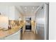 Well-lit kitchen featuring stainless steel appliances, granite counters, and decorative tile backsplash at 201 Ocean Blvd. S # 1505, North Myrtle Beach, SC 29582
