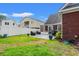 Lush green lawn in this backyard featuring a partially covered patio, perfect for entertaining guests at 2019 Ye Olde Kings Hwy., North Myrtle Beach, SC 29582