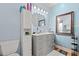 Bathroom featuring a vanity with a marble countertop and a wall mirror with unique lighting at 2019 Ye Olde Kings Hwy., North Myrtle Beach, SC 29582