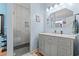 Bathroom featuring a walk-in tiled shower and a vanity with a marble countertop at 2019 Ye Olde Kings Hwy., North Myrtle Beach, SC 29582