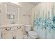 Bathroom with a pedestal sink, and a seashell patterned shower curtain offering style and functionality at 2019 Ye Olde Kings Hwy., North Myrtle Beach, SC 29582