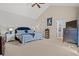 Bright bedroom featuring carpet, ceiling fan, and blue accents in the bedding and headboard at 2019 Ye Olde Kings Hwy., North Myrtle Beach, SC 29582