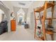 Well-lit bedroom showcasing a wooden shelf, desk, and comfortable seating area at 2019 Ye Olde Kings Hwy., North Myrtle Beach, SC 29582