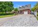 Attractive brick home with a well-maintained driveway, a spacious two-car garage, and appealing curb appeal at 2019 Ye Olde Kings Hwy., North Myrtle Beach, SC 29582