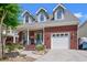 This brick home boasts a well-manicured front yard, cozy front porch, and a convenient one-car garage at 2019 Ye Olde Kings Hwy., North Myrtle Beach, SC 29582
