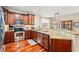 Gourmet kitchen featuring custom cabinetry, granite countertops, stainless steel appliances, and a breakfast bar at 2019 Ye Olde Kings Hwy., North Myrtle Beach, SC 29582