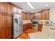 This kitchen is well-equipped with stainless steel appliances, granite countertops, and custom wood cabinets for storage at 2019 Ye Olde Kings Hwy., North Myrtle Beach, SC 29582