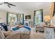 Comfortable living room with neutral tones, stylish seating, and a decorative fireplace with a wall-mounted television at 2019 Ye Olde Kings Hwy., North Myrtle Beach, SC 29582