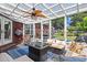 Enclosed sunroom with lots of seating with a view of the backyard and plenty of natural light at 2019 Ye Olde Kings Hwy., North Myrtle Beach, SC 29582