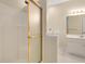 Bathroom featuring a walk-in bathtub with shower, vanity, mirror, and a glass door shower at 202 Glenwood Dr., Conway, SC 29526