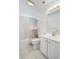Well-lit bathroom featuring a vanity, toilet, mirror, and shower with a decorative shower curtain at 202 Glenwood Dr., Conway, SC 29526