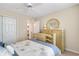 Cozy bedroom with a ceiling fan, neutral walls, closet, and a door leading to another room at 202 Glenwood Dr., Conway, SC 29526