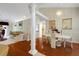 Elegant dining room featuring hardwood floors, a chandelier, and decorative columns at 202 Glenwood Dr., Conway, SC 29526
