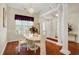 Elegant dining area with chandelier, hardwood floors, and view of front door at 202 Glenwood Dr., Conway, SC 29526