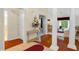 Inviting hallway with hardwood floors, columns, and views into adjacent rooms at 202 Glenwood Dr., Conway, SC 29526