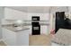 Well-maintained kitchen with white cabinets, granite countertops, and black appliances at 202 Glenwood Dr., Conway, SC 29526