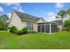Inviting home with a screen room, manicured landscaping, and a well-maintained lawn at 202 Glenwood Dr., Conway, SC 29526