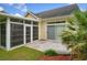 A cozy screen room adjoins a lovely paved patio and the home's backyard at 202 Glenwood Dr., Conway, SC 29526
