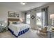 Cozy bedroom with natural light features a comfortable bed and stylish furnishings at 202 Meadow Sweet Pl, Conway, SC 29526