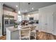 Modern kitchen with stainless steel appliances, granite countertops, and an island with bar seating at 202 Meadow Sweet Pl, Conway, SC 29526