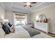 Comfortable main bedroom features a decorative dresser, natural light and soft textures at 202 Meadow Sweet Pl, Conway, SC 29526