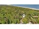 Drone shot of wooded property near the beach with coastal views and lots of trees at 206 Dogwood Dr., Myrtle Beach, SC 29575