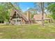 Charming two-story home with brick facade, fenced yard, and expansive windows for a bright interior at 206 Dogwood Dr., Myrtle Beach, SC 29575