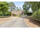Unique home exterior showcasing modern architecture, mature trees and a circular driveway at 206 Dogwood Dr., Myrtle Beach, SC 29575