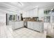 Open kitchen featuring white cabinets, tile floors, stainless dishwasher and ample countertop space at 206 Dogwood Dr., Myrtle Beach, SC 29575