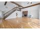 Bright living room with hardwood floors, exposed beams and a staircase leading to the second level at 206 Dogwood Dr., Myrtle Beach, SC 29575