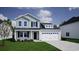 Charming two-story home features a landscaped front yard and an attached two-car garage at 264 Bolsin Ct, Conway, SC 29526