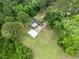 Aerial view showcases home, metal storage building, and abundant green space at 2776 Holly Rd., Marion, SC 29571