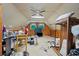 Attic area featuring windows and a ceiling fan at 2776 Holly Rd., Marion, SC 29571