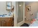Bathroom featuring a glass shower, wood vanity, and neutral decor at 2776 Holly Rd., Marion, SC 29571