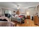 Bright bedroom with a ceiling fan, hardwood floors, and natural light at 2776 Holly Rd., Marion, SC 29571