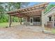 Spacious carport with wooden supports, great for covered parking and outdoor gatherings at 2776 Holly Rd., Marion, SC 29571