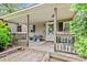 Inviting front porch with seating area, perfect for relaxing and enjoying the outdoors at 2776 Holly Rd., Marion, SC 29571