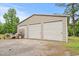 Detached garage with multiple bays and a gravel driveway at 2776 Holly Rd., Marion, SC 29571