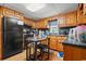 A well-lit kitchen with wooden cabinets, providing ample storage and counter space at 2776 Holly Rd., Marion, SC 29571