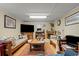 Living room featuring comfortable seating and a fireplace, perfect for gatherings and relaxation at 2776 Holly Rd., Marion, SC 29571
