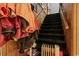 Carpeted staircase featuring a wood handrail, and paneled walls at 2776 Holly Rd., Marion, SC 29571
