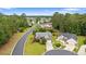 Aerial view showcases the beautiful neighborhood with tree-lined streets and well-maintained homes at 3 Birdsong Ct., Murrells Inlet, SC 29576