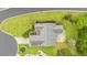 An aerial view showcasing the home's well-manicured landscaping and surrounding greenery in a desirable neighborhood at 3 Birdsong Ct., Murrells Inlet, SC 29576