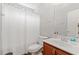Bathroom with a sink, mirror, toilet and shower with curtain at 3 Birdsong Ct., Murrells Inlet, SC 29576