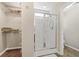 Bathroom with a glass enclosed shower and a view into the walk-in closet with wire shelving at 3 Birdsong Ct., Murrells Inlet, SC 29576