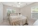 Cozy bedroom with a ceiling fan and two windows offering natural light at 3 Birdsong Ct., Murrells Inlet, SC 29576
