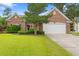 Charming single-story brick home with a well-manicured lawn and attached two-car garage at 3 Birdsong Ct., Murrells Inlet, SC 29576