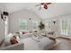 Bright living room featuring high vaulted ceilings, a ceiling fan, and an array of seating options at 3 Birdsong Ct., Murrells Inlet, SC 29576