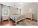 Main bedroom featuring a decorative bed frame, matching nightstands, and a large dresser at 3 Birdsong Ct., Murrells Inlet, SC 29576