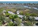 Aerial view of townhomes surrounded by trees near the water, offering a tranquil and picturesque setting at 306 Salt Marsh Circle # 5A, Pawleys Island, SC 29585